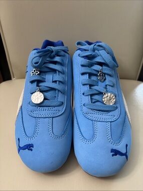 NWOT Puma woman’s Light Blue Sneakers with White Formstrip . BRAND NEW